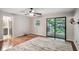 Spacious main bedroom features hardwood floors, ceiling fan, and sliding doors at 9055 Green Valley Ct, Douglasville, GA 30134