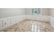 Bright, carpeted room with decorative molding, offering a clean and elegant space for living or dining at 9055 Green Valley Ct, Douglasville, GA 30134
