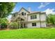 Exterior of a home with a large wooden deck overlooking the lush green backyard at 1345 Benbrooke Nw Ln, Acworth, GA 30101