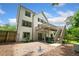 Spacious backyard with a large patio, wooden stairs, and second story wooden deck at 1345 Benbrooke Nw Ln, Acworth, GA 30101