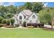 Charming two-story home with well-manicured lawn and mature landscaping at 1345 Benbrooke Nw Ln, Acworth, GA 30101