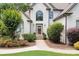 Inviting front entrance with a well-kept lawn and lovely landscaping at 1345 Benbrooke Nw Ln, Acworth, GA 30101