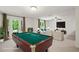 The game room features a billiards table, plush carpet, and comfortable seating at 1345 Benbrooke Nw Ln, Acworth, GA 30101