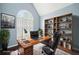 Well-appointed home office with built-in shelving and ample natural light at 1345 Benbrooke Nw Ln, Acworth, GA 30101