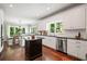 Open kitchen design featuring stainless steel appliances, granite counters, and hardwood flooring at 1345 Benbrooke Nw Ln, Acworth, GA 30101