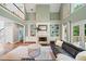 Open-concept living room featuring fireplace, built-in shelving, and hardwood floors at 1345 Benbrooke Nw Ln, Acworth, GA 30101