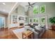 Spacious living room with fireplace, built-in bookshelves, and large windows at 1345 Benbrooke Nw Ln, Acworth, GA 30101