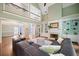 Bright living room with a fireplace, built-in shelving, and soaring ceilings leading to the second level at 1345 Benbrooke Nw Ln, Acworth, GA 30101