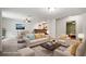 Bright living room with fireplace, plush seating, and seamless flow to the dining area and bedroom at 1345 Benbrooke Nw Ln, Acworth, GA 30101