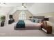 The airy bedroom features neutral colors, plush carpet, a large window, ceiling fan, and comfortable seating at 1345 Benbrooke Nw Ln, Acworth, GA 30101