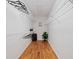 Organized walk-in closet with wire shelving, hardwood floors, and ample storage space at 1345 Benbrooke Nw Ln, Acworth, GA 30101