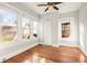 Bright bedroom featuring hardwood floors, built-in storage, and large windows at 1015 Deckner Sw Ave, Atlanta, GA 30310