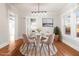 Cozy dining room featuring modern lighting, a round table, and views of the outdoors at 1015 Deckner Sw Ave, Atlanta, GA 30310