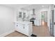 Renovated kitchen with an island, stainless steel appliances, and white cabinets at 1015 Deckner Sw Ave, Atlanta, GA 30310