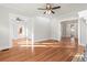 Expansive living area featuring hardwood floors, ample natural light, and seamless flow between rooms at 1015 Deckner Sw Ave, Atlanta, GA 30310
