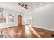 Spacious living area with hardwood floors, a fireplace, and large windows offering plenty of natural light at 1015 Deckner Sw Ave, Atlanta, GA 30310