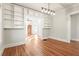 Open living room with hardwood floors and built-in shelving for extra storage and style at 1015 Deckner Sw Ave, Atlanta, GA 30310
