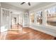 Bright living room with hardwood floors, white trim, and large windows for ample natural light at 1015 Deckner Sw Ave, Atlanta, GA 30310