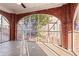 Bright sunroom with brick detailing and arched windows overlooking the backyard at 1015 Deckner Sw Ave, Atlanta, GA 30310