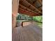 This back porch is covered and provides privacy at 10591 Flat Shoals Rd Rd, Covington, GA 30016