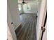 Bright bedroom with new floors, ceiling fan, and natural light from two windows at 10591 Flat Shoals Rd Rd, Covington, GA 30016