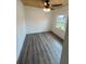 This bedroom boasts a ceiling fan and a bright window, creating a cozy and inviting atmosphere at 10591 Flat Shoals Rd Rd, Covington, GA 30016