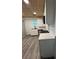 This kitchen features stainless steel appliances, white cabinets, and elegant countertops at 10591 Flat Shoals Rd Rd, Covington, GA 30016