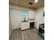 This kitchen features stainless steel appliances, white cabinets, and a modern sink at 10591 Flat Shoals Rd Rd, Covington, GA 30016