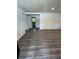 Spacious living room with modern gray wood flooring and fresh neutral paint at 10591 Flat Shoals Rd Rd, Covington, GA 30016