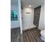 Newly tiled shower with upgraded fixtures, a storage niche, and modern flooring at 10591 Flat Shoals Rd Rd, Covington, GA 30016