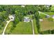 Aerial view shows a house with a long driveway and vast land at 146 Henderson Farm Ln, Canton, GA 30115