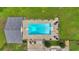 Aerial view shows a rectangular pool with chairs and trees and a house at 146 Henderson Farm Ln, Canton, GA 30115