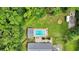 Aerial view shows a rectangular pool with a house, a trailer, and a firepit at 146 Henderson Farm Ln, Canton, GA 30115