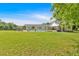 Expansive backyard with an in-ground pool, green grass, and ample space for outdoor activities at 146 Henderson Farm Ln, Canton, GA 30115