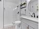 Modern bathroom with sleek glass shower, black fixtures, and gray vanity at 146 Henderson Farm Ln, Canton, GA 30115