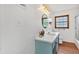 Bathroom features a vanity, mirror, natural light from the window, and a shower/tub for your everyday needs at 146 Henderson Farm Ln, Canton, GA 30115