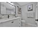 Stylish bathroom boasts marble counter, black fixtures, and patterned floor tiles at 146 Henderson Farm Ln, Canton, GA 30115