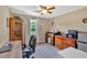 Office area with multiple desk areas, ceiling fan, and natural light for a quiet workspace at 146 Henderson Farm Ln, Canton, GA 30115