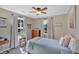 Cozy bedroom with soft lighting, comfortable bed, natural light, and neutral color palette creating a relaxing space at 146 Henderson Farm Ln, Canton, GA 30115