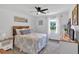 Comfortable bedroom with bed, dresser, and window for ample light at 146 Henderson Farm Ln, Canton, GA 30115