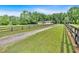 Long driveway leading to a charming home with a fence on both sides at 146 Henderson Farm Ln, Canton, GA 30115