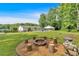 Enjoy a fire pit in your backyard surrounded by mature trees, green grass, a pool, and plenty of room to relax at 146 Henderson Farm Ln, Canton, GA 30115