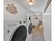 Spacious laundry room with modern washer and dryer units and bright lighting at 146 Henderson Farm Ln, Canton, GA 30115