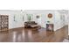 Inviting living room featuring hardwood floors, a leather sofa, and large windows at 146 Henderson Farm Ln, Canton, GA 30115
