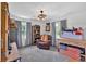 Cozy living room offers natural lighting, a ceiling fan, and comfortable armchair at 146 Henderson Farm Ln, Canton, GA 30115