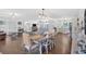 Open-concept living room and dining area, showcasing hardwood floors and bright natural light at 146 Henderson Farm Ln, Canton, GA 30115