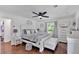 Bright main bedroom features dark wood floors, ceiling fan, and upholstered ottoman at 146 Henderson Farm Ln, Canton, GA 30115