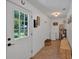 Bright mudroom entrance with tile flooring, natural light, and storage and utility access at 146 Henderson Farm Ln, Canton, GA 30115