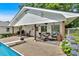 Poolside patio with seating and outdoor dining area, offering a relaxing outdoor space at 146 Henderson Farm Ln, Canton, GA 30115
