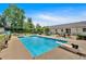 Backyard pool area with a diving board and lush greenery, perfect for relaxation and recreation at 146 Henderson Farm Ln, Canton, GA 30115